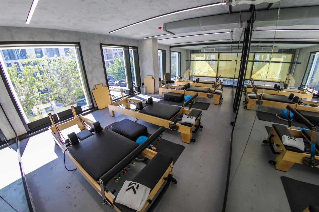 The reformer pilates studio at MORE, looking out over Waterfront City